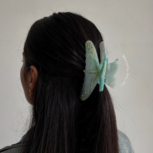 Pinza estrella de mar turquesa