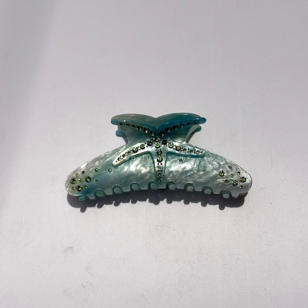 Pinza estrella de mar turquesa