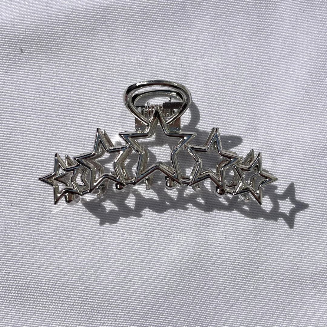 Pinza estrellas plateada
